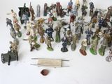 many figurines of different types and sizes on the table