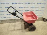 a red wheelbarrow with a black handle and a black wheelbarrow wheelbarrow