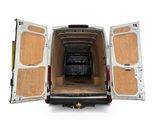 a white van with its doors open and a black car in the back