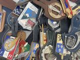 many different types of badges and badges on a table
