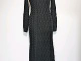 the dress is black and has long sleeves on it