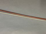 a long wooden stick with a long handle on a table