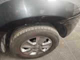 a close up of a car ' s tire on the floor