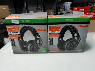 two boxes of headphones sitting on a table in a store
