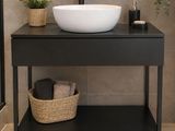 a bathroom with a sink and a mirror on the wall