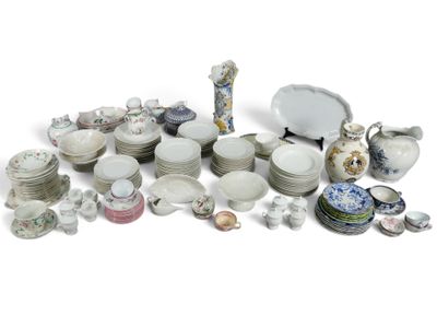 many different types of dishes and cups on the table