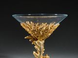 an image of a glass bowl with a gold decoration on it