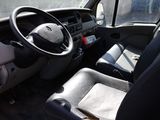 a view of the inside of a bus with the driver ' s seat up