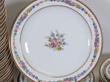 many plates stacked on top of each other on a table