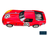 a red toy car with a number on it