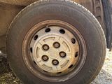 a flat tire on a flatbed truck parked on the side of the road