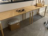 a desk with a computer on it in the corner of a room