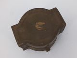 an old wooden box with a small hole in the middle of it