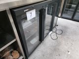 stainless steel counter top with two glass doors and a number 7 on it