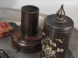 a metal tray with a knife and a canister on it
