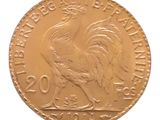 l'image d'une pièce d'or ornée d'un coq
