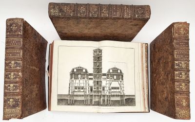 a book opened to show a drawing of a building