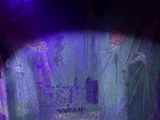 a blurry image of a group of people standing in a cave