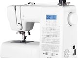 a white sewing machine sitting on top of a white table