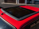 a red car parked on the side of the street