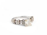 a close up of a diamond ring on a white background