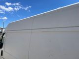 a white van that is parked in a lot