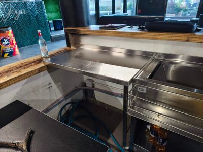 a kitchen with a sink and a window in it