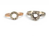 three different colored gold and silver rings on a white background