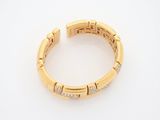 an 18k gold and diamond bang bracelet