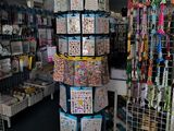a tall tower of cards in a store with a lot of cards on it