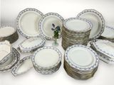 a lot of plates that are stacked together on the table