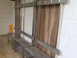 a wooden bench and a metal shelf in a room