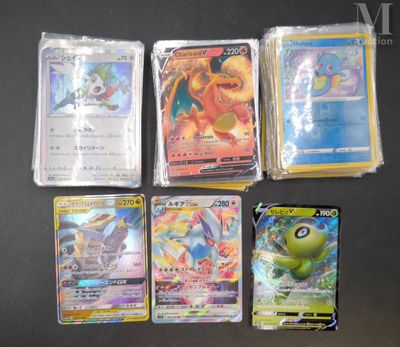 several pokemon cards are lined up on a black surface