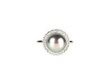 an image of a pearl and diamond ring on a white background