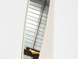 a mirror that is sitting on top of a table
