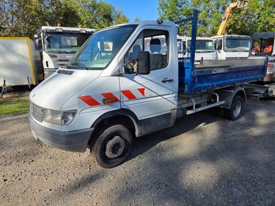 a truck that is parked in a lot with other trucks in the background