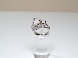 a ring that is sitting on top of a clear glass