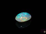 a close up of a white oplite in a black background