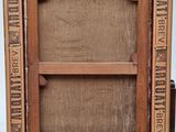 an old wooden picture frame with a picture of a man on it