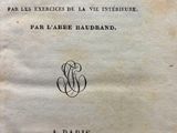 an old book with a black and white image of a woman ' s face