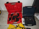 a red tool case with tools in it on the floor