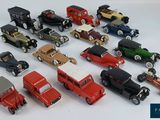 a lot of toy cars that are sitting on a table