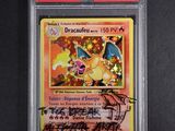 a close up of a pokemon card on a black surface