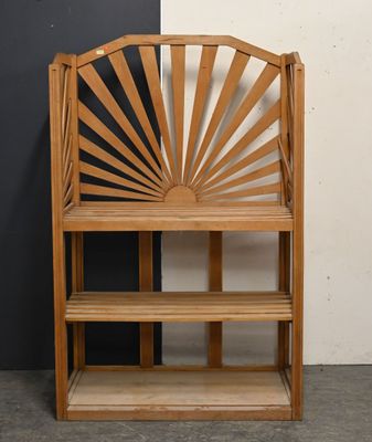 a wooden bench with a shelf in front of a black and white wall