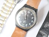 a watch that is sitting on a table next to other watches