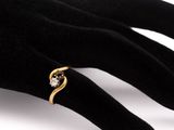 a close up of a person ' s hand with a ring on it ' s finger