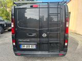 a black van that is parked in a parking lot