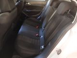a black seat in the back of a white car