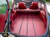 the interior of a car with the door open and the seats down