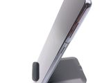 a cell phone that is sitting on a stand